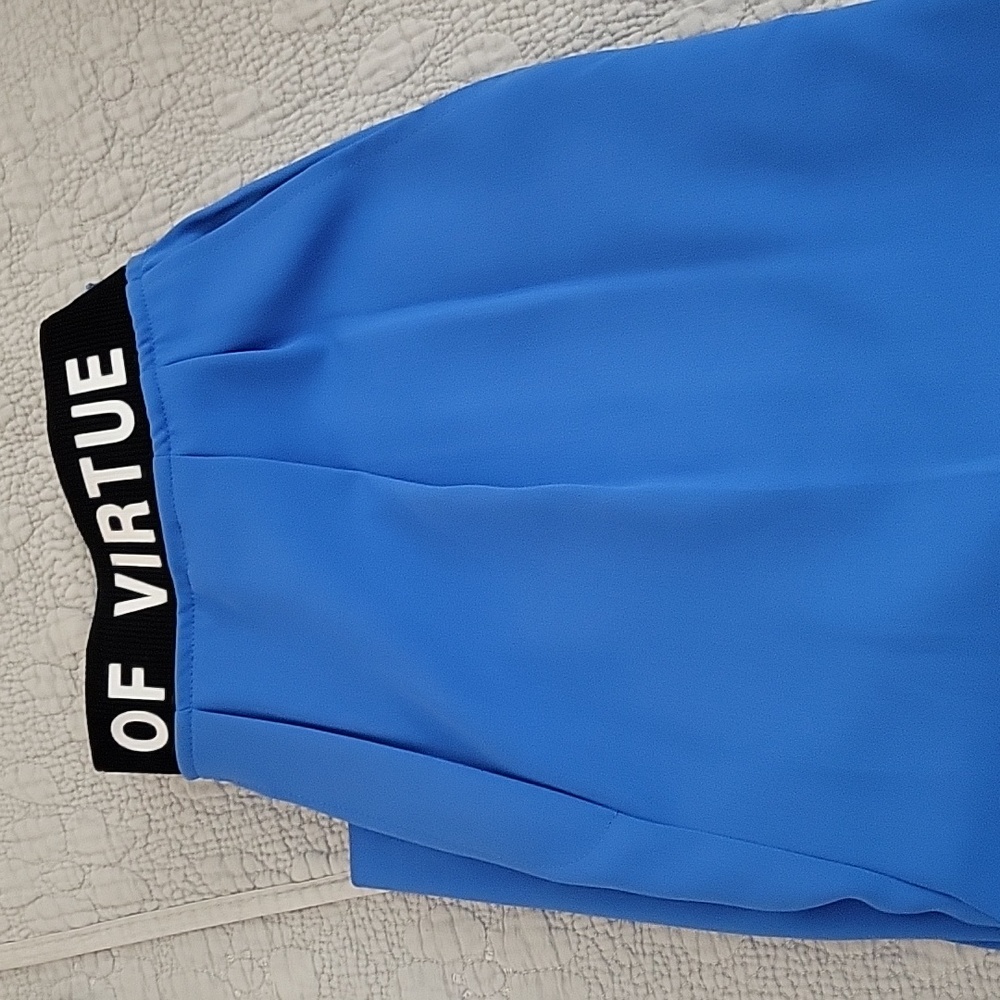 Blue pants with elastic waistband and side zipper.
